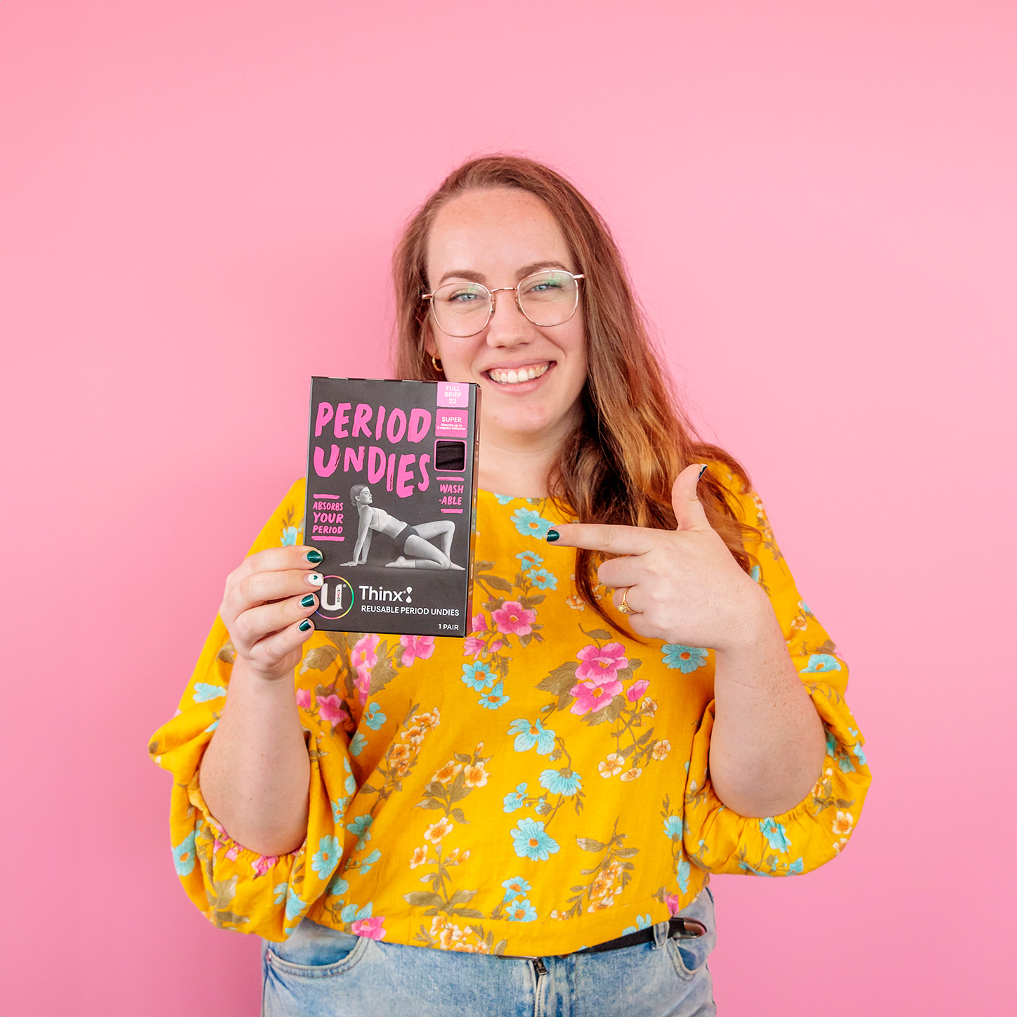 A woman holding U by Kotex period underwear